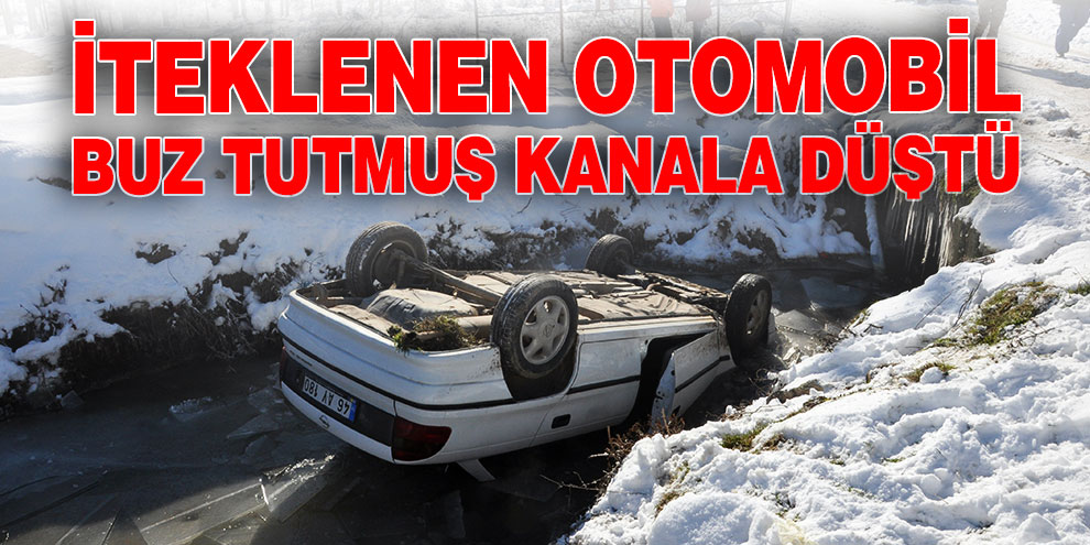 İteklenen otomobil buz tutmuş kanala düştü