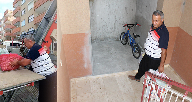 Asansörü olmayan binadaki dairesine pazar alışverişini vinçle çıkardı