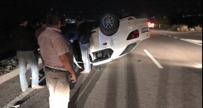 Takla atan otomobilden burnu kanamadan çıktı