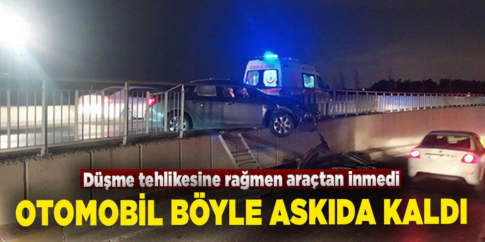 Askıda kalan otomobilden düşme tehlikesine rağmen inmedi