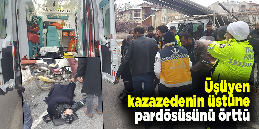 Üşüyen kazazedenin üstüne pardösüsünü örttü